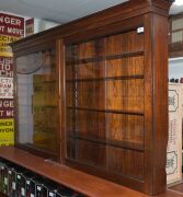 A rare Australian cedar two door wall cabinet with glazed doors and four adjustable shelves, full cedar construction, New South Wales origin, mid 19th century, 96cm high, 173cm wide, 19cm deep - 2