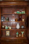 An Australian cedar bookcase with a cavetto pediment, two arch-top glazed doors, conforming lower panelled doors, an ogee-moulded drawer and carved corbels, 19th century, 235cm high, 114cm wide, 44cm deep - 6