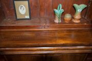 An Australian cedar bookcase with a cavetto pediment, two arch-top glazed doors, conforming lower panelled doors, an ogee-moulded drawer and carved corbels, 19th century, 235cm high, 114cm wide, 44cm deep - 7