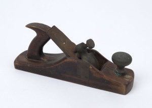 An antique hand plane, hardwood and steel with brass blade keeper, 19th century, ​30cm sole