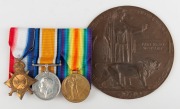WWI BRONZE MEMORIAL PLAQUE (Death Penny): inscribed 'He Died for Freedom and Honour',&nbsp;in the name&nbsp;of 'JOHN HENRY WESTCOTT', and issued to his next of kin, blank on reverse,&nbsp;120cm diameter; together with his trio of medals: 1914-15 Star, unnamed; 1914-18 B