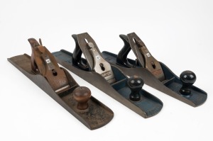 A group of three hand planes including Bailey No.7, Carter No.6 and No.7. Australia made examples, the largest 56cm long.