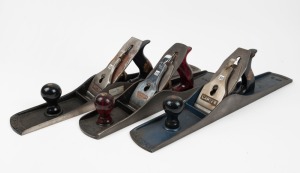 A group of three hand planes, two Australian No.7 planes by Carter, and a Turner No.6 also made in Australia, the largest 55cm long.