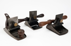 Three Stanley hand tools comprising of No.112 hand plane fitted with Stanley sweetheart toothing blade, Stanley No.12 and No.12½ veneer scrapers, the largest 24cm long.