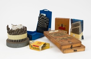 A large selection of drill bits ranging from Cleveland no.13, a set wood bits, Sutton high speed steel bits, P&W tools screw extracators, and other drill bits, (8 items total), largest drill bit ⅜ inch.