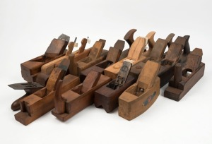 A large selection of wooden planes, various makers and models, including John Moseley & Sons chamfer plane, panel raising plane with adjustable fence, and others, (14 items total), the largest 38cm long.