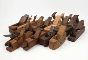 A large selection of wooden planes, various makers and models, including John Moseley & Sons chamfer plane, panel raising plane with adjustable fence, and others, (14 items total), the largest 38cm long.