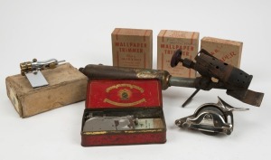 A group of wallpaper tools, including wallpaper trimmers, cutting wheels and blowtorch scrapper, (6 items total), the largest item 42cm long.