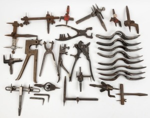 A large quantity of leather working tools including cutters and hole punches, various makes and models, (qty) the largest hole punch 23cm long.