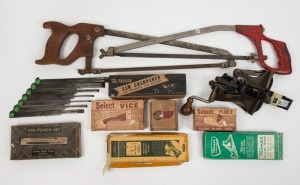 A group of Turner plane irons in boxes, Mathieson & Sons plough blades, two pruning saws, saw sharpener, and a saw blade setter, (12 items total), the largest saw 57cm long.