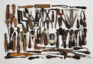A collection of leather working tools, including hole punchers and blades, in various sizes and manufacturers,  (qty 40+), the largest 20cm long.