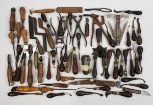 A collection of leather working tools, including hole punchers and blades, in various sizes and manufacturers, (qty 40+), the largest 20cm long.