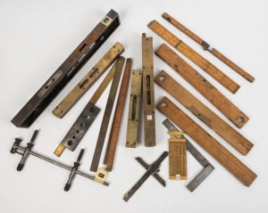 A selection of measuring instruments, rope gauge sliding calipers, imperial folding rulers and various spirit levels (most imperial sizing), (14 items total), the largest 38cm long.