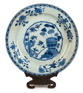 An antique Chinese blue and white porcelain charger on carved rosewood stand, Qing Dynasty, 18th/19th century, ​​​​​​​41cm diameter