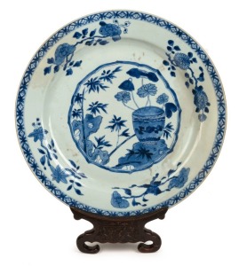 An antique Chinese blue and white porcelain charger on carved rosewood stand, Qing Dynasty, 18th/19th century, 41cm diameter