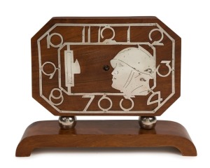 An Art Deco walnut mantle clock with chromed Arabic numerals and military profile portrait, circa 1930, ​​​​​​​22cm high, 29cm wide