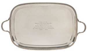 An English sterling silver serving tray, with inscription "Presented To Robert J. Elliston Esq. J.P. By The Directors Of Hazell. Watson & Viney. Ltd. As A Mark Of Their Appreciation Of His 31 Years Association With The Company. 1889-1920", made in Sheffield, by Martin Hall & Company, circa 1904, 67cm across the handles 2,930 grams