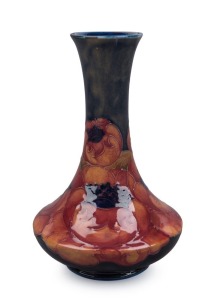 MOORCROFT "Poppy" pattern English pottery vase on blue ground, impressed "Moorcroft, Made In England", 16cm high