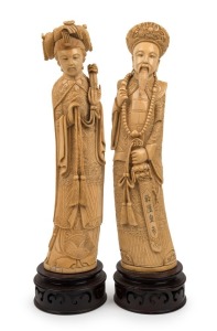 A pair of Chinese carved ivory statues of a Mandarin court official and wife, on carved wooden stands, 19th/20th century, ​​​​​​​34.5cm high