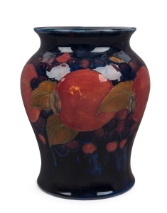 MOORCROFT "Pomegranate" pattern English pottery vase on blue ground, impressed "Moorcroft, Made In England", 14.5cm high