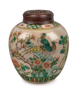 An antique Chinese famille vert porcelain ginger jar with carved timber lid, Qing Dynasty, 19th century, red four character mark to base, 24cm high
