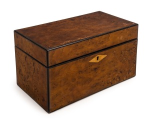 A Georgian tea caddy, burr elm with ebony stringing and bone escutcheon. Interior fitted with two mahogany lidded compartmentS with boxwood stringing and whalebone knobs, early 19th century, 11.5cm high, 20cm wide, 11cm deep