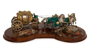 A superb Italian silver and gilt finish horse and carriage procession ornament, sumptuously adorned with semi-precious stones and enamel decoration, all mounted on a rosewood timber base, mid 20th century, 67cm wide, approximately 3+kg silver weight