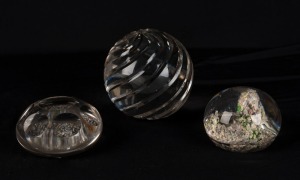 Three antique glass paperweights, 19th century, the largest 9cm high