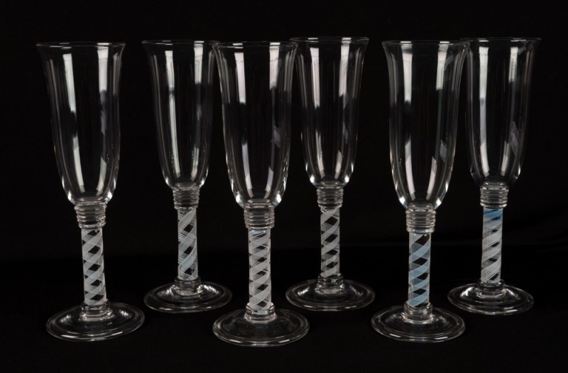 A set of six champagne flutes with air twist stems, early to mid 20th century, ​​​​​​​25.5cm high