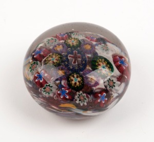 An antique millefiori glass paperweight, 19th century, 4cm high, 6.5cm diameter