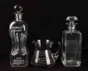 Two antique whisky advertising decanters and a water jug, 19th century, (3 items), ​​​​​​​the largest 31cm high