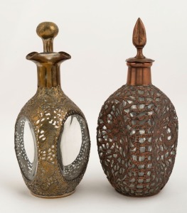 DIMPLE WHISKEY decanters, two examples with Chinese dragon decoration in copper and brass, 19th/20th century. Note: these would most likely have been silver plated originally. 27cm and 28cm high