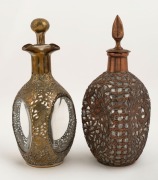 DIMPLE WHISKEY&nbsp;decanters, two examples with Chinese dragon decoration in copper and brass, 19th/20th century. Note: these would most likely have been silver plated originally. 27cm and 28cm high