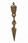 A Tibetan vajra, cast bronze with gilt finish, 20th century, ​​​​​​​31.5cm long