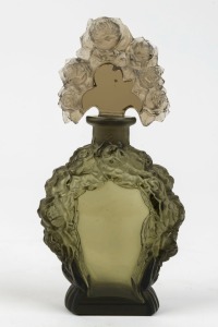 A Bohemian Art Deco glass perfume bottle with pressed floral decoration, circa 1920s, ​​​​​​​15cm high