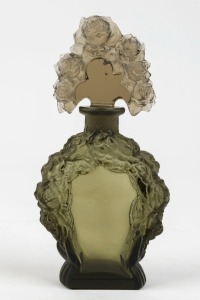 A Bohemian Art Deco glass perfume bottle with pressed floral decoration, circa 1920s, 15cm high