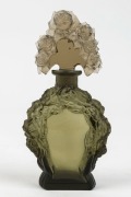 A Bohemian Art Deco glass perfume bottle with pressed floral decoration, circa 1920s, ​​​​​​​15cm high