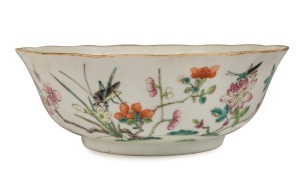 An antique Chinese famille vert bowl adorned with insects and flowers, 18th/19th century, red seal mark to base, 6.5cm high, 18cm diameter