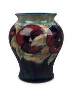 MOORCROFT&nbsp;"Pansy" English pottery vase on celadon and blue ground, impressed "Moorcroft" with green underglaze signature, 17cm high