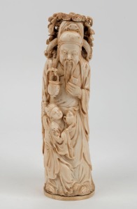 An antique Chinese carved ivory statue of a man with and a young boy, 19th/20th century, ​​​​​​​seal mark to base, 21.5cm high