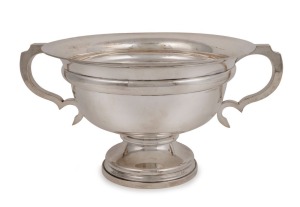 An antique sterling silver punch bowl with two handles by Walker & Hall of Sheffield, early 20th century, ​​​​​​​18cm high, 36.5cm wide, 1145 grams