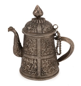 A Bhutanese silver teapot with finely chased decoration, 19th century, ​​​​​​​17cm high, 410 grams