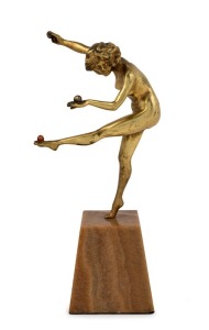 An Art Deco gilt bronze statue of a dancing ball lady, mounted on a brown onyx plinth, circa 1930, ​​​​​​​23cm high