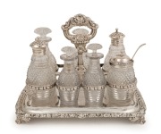 A Georgian sterling silver cruet set with six bottles, by Richard Pouldon of London, circa 1823, 23cm high, ​​​​​​​1480 grams silver weight