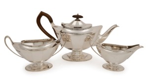 An English sterling silver three piece tea set by Robert Stewart of London, circa 1914, 18cm high, 1104 grams total including handle