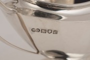 An English sterling silver three piece tea set by Robert Stewart of London, circa 1914, 18cm high, 1104 grams total including handle - 3