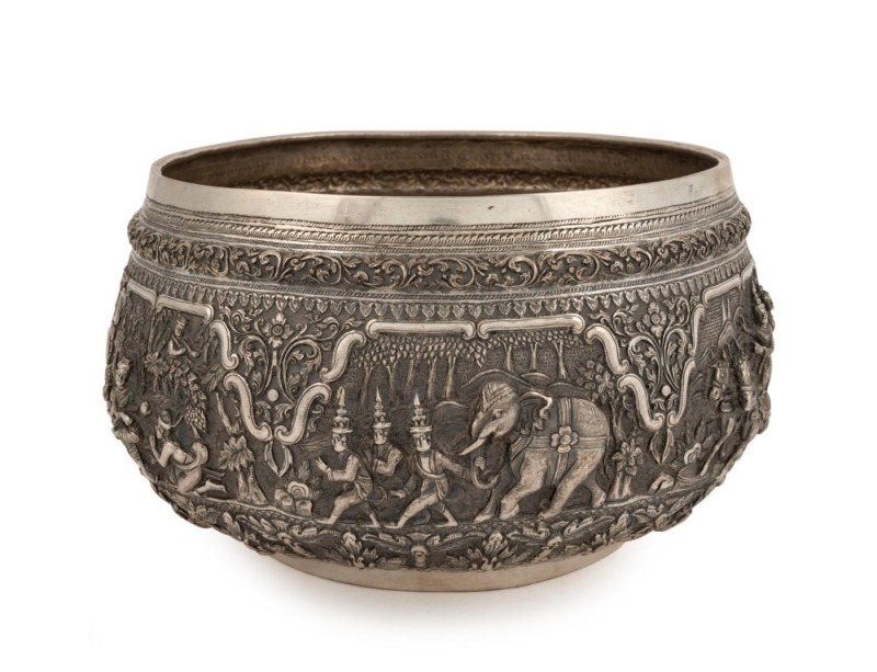 An antique Burmese silver bowl, impressively decorated in fine repousse work, early to mid 20th century. Note: later PAN AMERICAN AIRWAYS inscription to base. 14.5cm high, 25.5cm wide, ​​​​​​​1152 grams