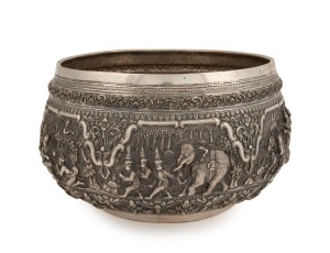 An antique Burmese silver bowl, impressively decorated in fine repousse work, early to mid 20th century. Note: later PAN AMERICAN AIRWAYS inscription to base. 14.5cm high, 25.5cm wide, 1152 grams