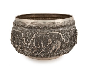 An antique Burmese silver bowl, impressively decorated in fine repousse work, early to mid 20th century. Note: later PAN AMERICAN AIRWAYS inscription to base. 14.5cm high, 25.5cm wide, ​​​​​​​1152 grams