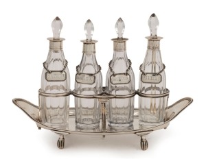 A fine Georgian sterling silver cruet set with four bottles and matched labels including "CHILLI", "KETCHUP", "ANCHOVY" and "CAVICE", by William Southey of London, circa 1828, 16cm high, 22cm wide